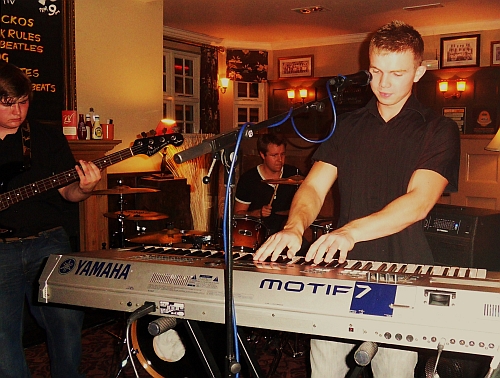 Robbie Ceredig-Evans on keyboard and vocals Robbie Ceredig-Evans plays keyboard and sings for "Six is Out"