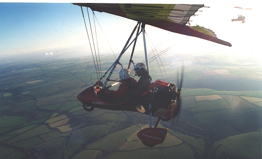 Selwyn flying in a microlight over North Cornwall